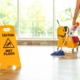Image of a janitor mopping the floor.